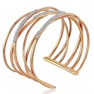  Slender bands of 18ct rose gold and rows of brilliant diamonds interlock to lend this beautiful cuff bracelet a feminine yet striking presence.